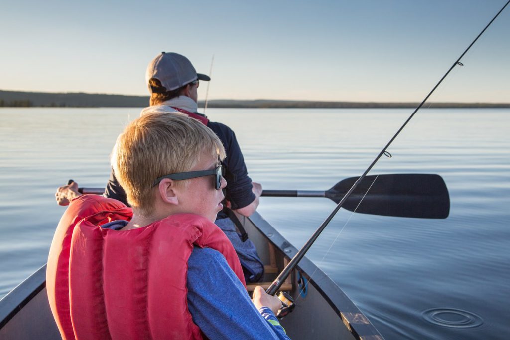 boy and man fishing