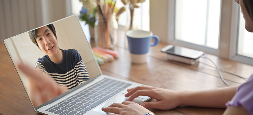 two people having a chat on laptop