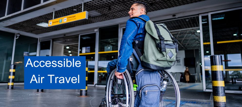 a man using a wheelchair at the entrance of an airport