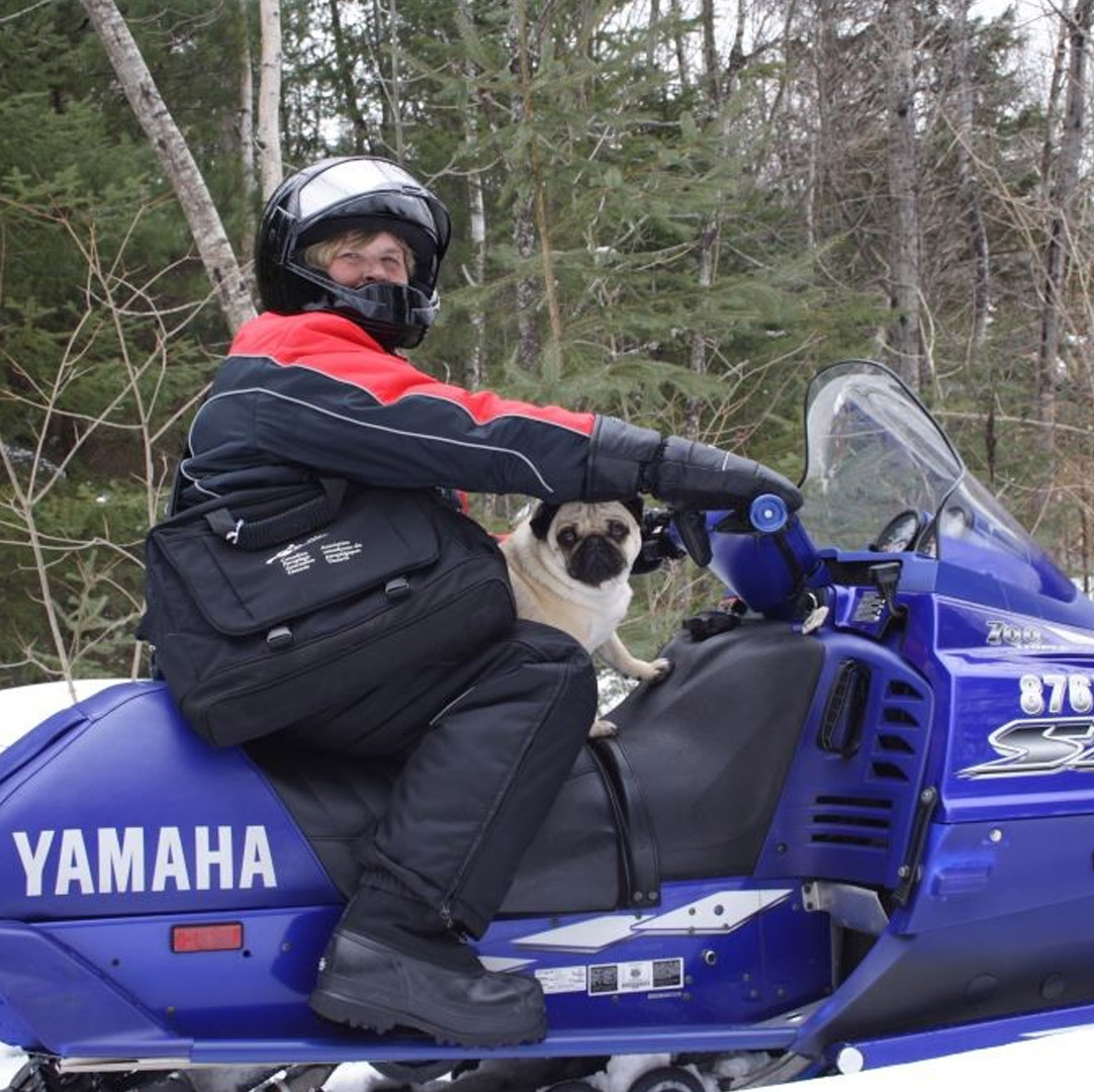 Heather on a snowmobile