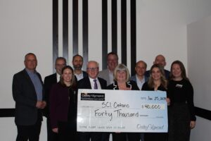 Group image of a number of individuals recognizing a donation to SCIO.