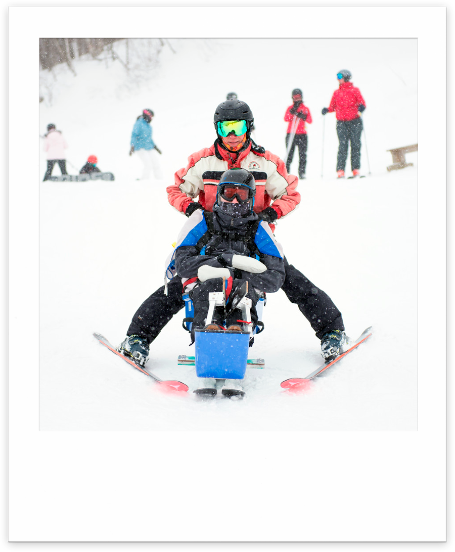 sit-skier with instructor