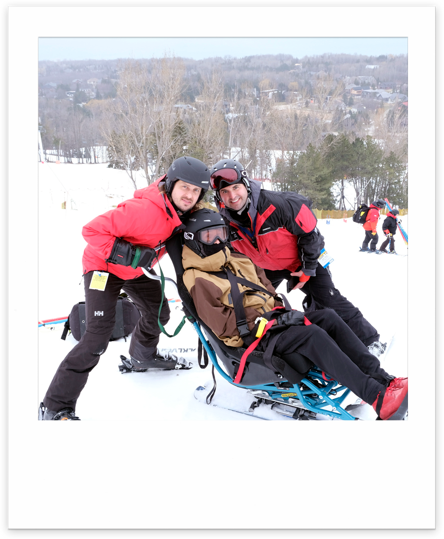 sit skier with two ski instructors