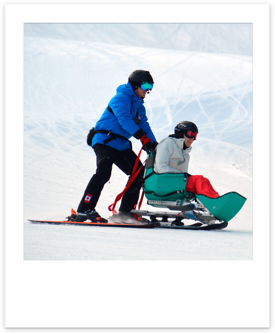 sit-skier and assistant