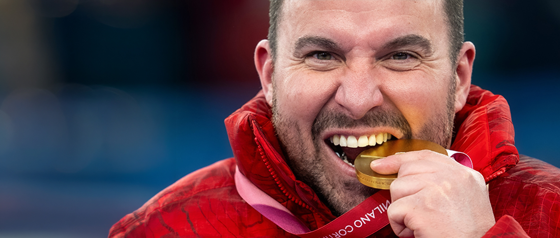 Jon Thurston bites his gold medal