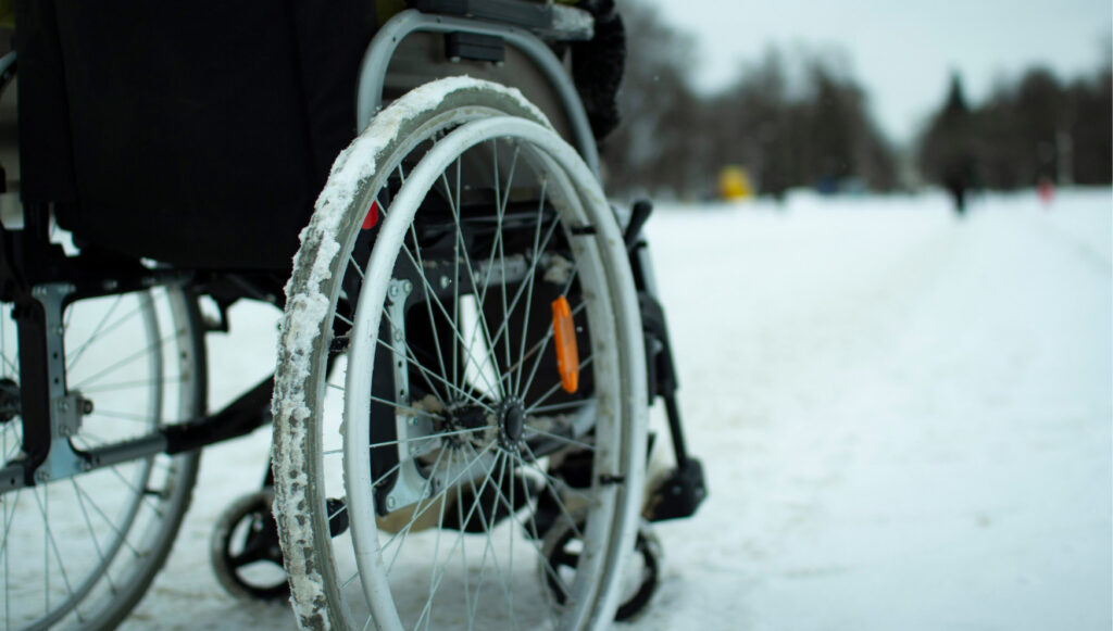 Wheelchair on snowy path